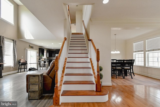 223 Fitzgerald St, Gerrardstown, WV 25420 - staircase featuring wood finished floors, a towering ceiling, ornamental molding, a chandelier, and recessed lighting