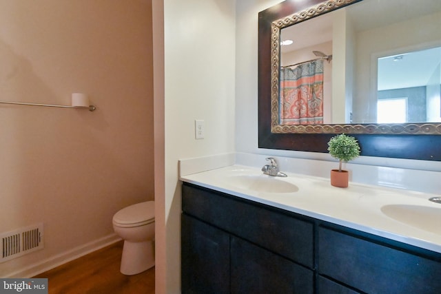 223 Fitzgerald St, Gerrardstown, WV 25420 - full bathroom featuring double vanity and wood finished floors