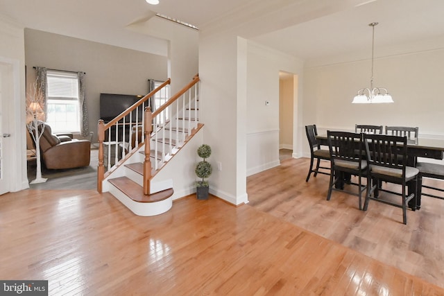 223 Fitzgerald St, Gerrardstown, WV 25420 - dining room featuring hardwood / wood-style flooring, a chandelier, and stairway