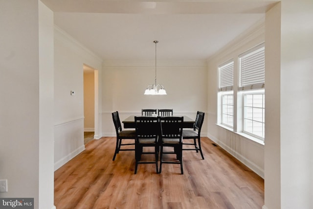 223 Fitzgerald St, Gerrardstown, WV 25420 - dining space with a chandelier, ornamental molding, and light wood-style flooring