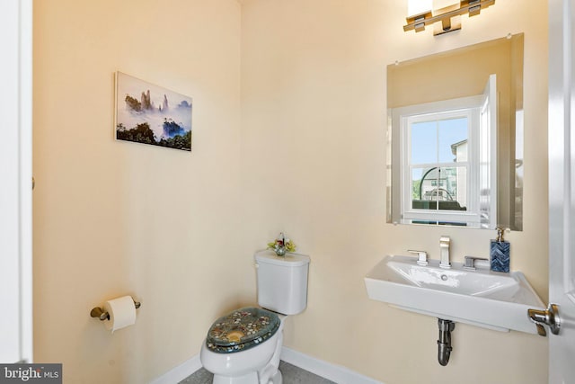 22416 Philanthropic Dr, Ashburn, VA 20148 - half bathroom featuring toilet and baseboards