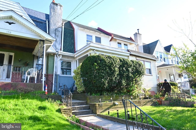 168 E Essex Ave, Lansdowne, PA 19050 - view of front of property with a chimney and a front yard