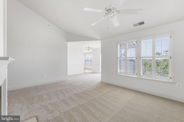 12824 Clarksburg Square Rd Unit 406, Clarksburg, MD 20871 - unfurnished living room featuring carpet floors, healthy amount of natural light, lofted ceiling, a chandelier, and a fireplace