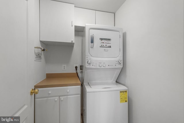 12824 Clarksburg Square Rd Unit 406, Clarksburg, MD 20871 - laundry area with estacked washer and dryer and cabinet space