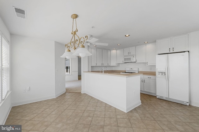 12824 Clarksburg Square Rd Unit 406, Clarksburg, MD 20871 - kitchen featuring white appliances, white cabinetry, light countertops, recessed lighting, and decorative light fixtures