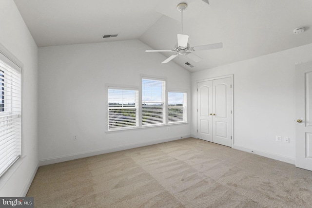 12824 Clarksburg Square Rd Unit 406, Clarksburg, MD 20871 - unfurnished bedroom featuring carpet flooring, lofted ceiling, ceiling fan, and a closet
