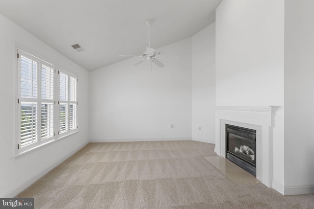 12824 Clarksburg Square Rd Unit 406, Clarksburg, MD 20871 - unfurnished living room with vaulted ceiling, carpet flooring, a fireplace with flush hearth, and a ceiling fan