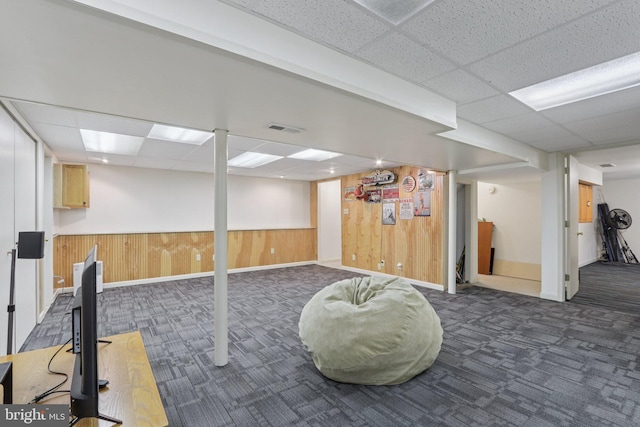 611 Hillcrest Dr, Perkasie, PA 18944 - finished below grade area featuring dark colored carpet, a paneled ceiling, wooden walls, and wainscoting