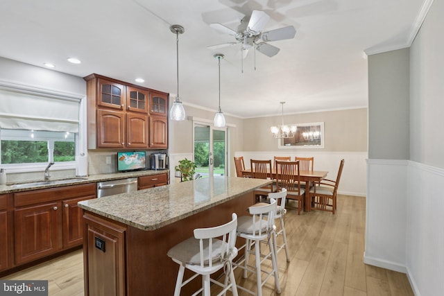 611 Hillcrest Dr, Perkasie, PA 18944 - kitchen featuring a kitchen breakfast bar, light stone countertops, glass insert cabinets, ceiling fan, and a kitchen island