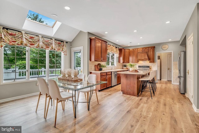 14 Canaday Ct, Belle Mead, NJ 08502 - dining space featuring a skylight, light wood-type flooring, and recessed lighting