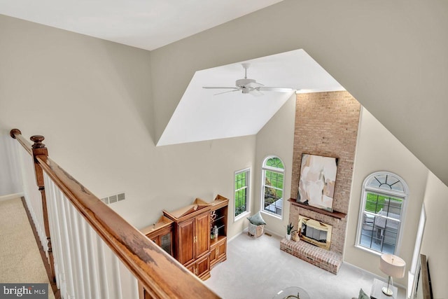 14 Canaday Ct, Belle Mead, NJ 08502 - living room featuring carpet flooring, plenty of natural light, high vaulted ceiling, a ceiling fan, and a fireplace