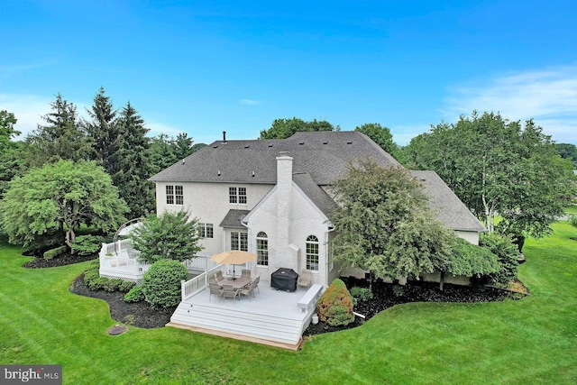 14 Canaday Ct, Belle Mead, NJ 08502 - rear view of house with a lawn, a chimney, stucco siding, and roof with shingles