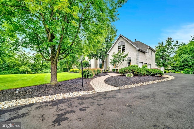 14 Canaday Ct, Belle Mead, NJ 08502 - view of front facade featuring driveway, a front yard, and a garage