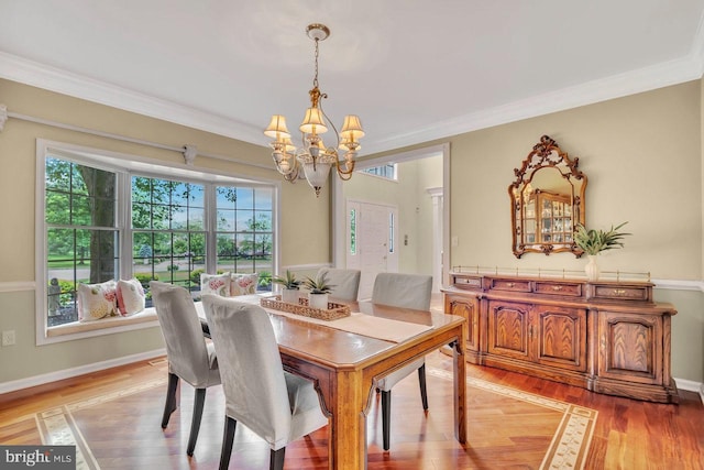 14 Canaday Ct, Belle Mead, NJ 08502 - dining area with a chandelier, light wood-type flooring, and crown molding