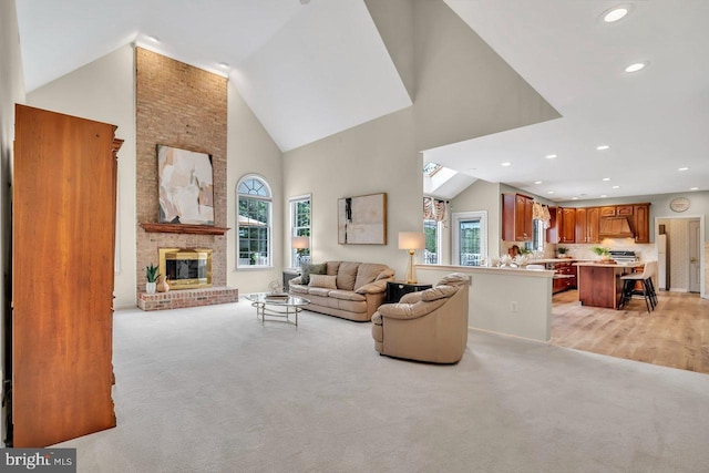 14 Canaday Ct, Belle Mead, NJ 08502 - living area featuring high vaulted ceiling, healthy amount of natural light, light colored carpet, a brick fireplace, and recessed lighting