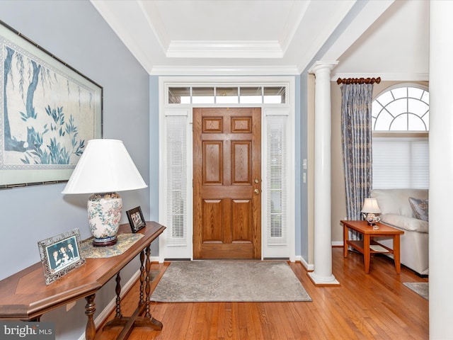 10600 Edwardian Ln, New Market, MD 21774 - foyer entrance with ornate columns, a raised ceiling, hardwood / wood-style floors, and ornamental molding