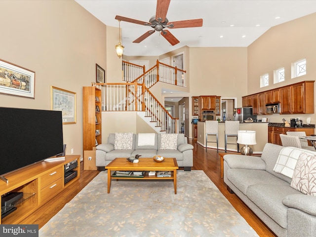 10600 Edwardian Ln, New Market, MD 21774 - living room with a towering ceiling, stairs, ceiling fan, wood finished floors, and recessed lighting