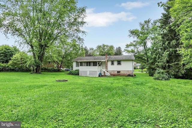 301 N Lynbrook Dr N, York, PA 17402 - back of property featuring a lawn and a chimney