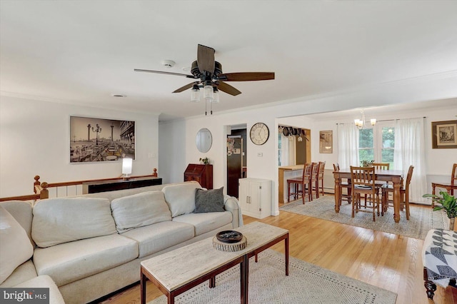 301 N Lynbrook Dr N, York, PA 17402 - living area with a chandelier, ornamental molding, light wood-style floors, and ceiling fan