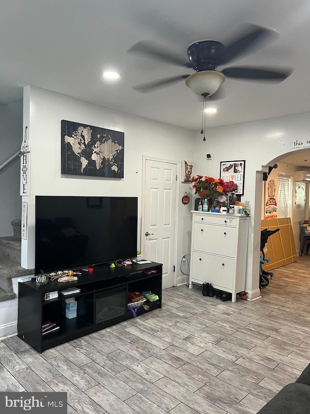2612 E Somerset St, Philadelphia, PA 19134 - living area featuring ceiling fan, arched walkways, stairs, wood finished floors, and recessed lighting