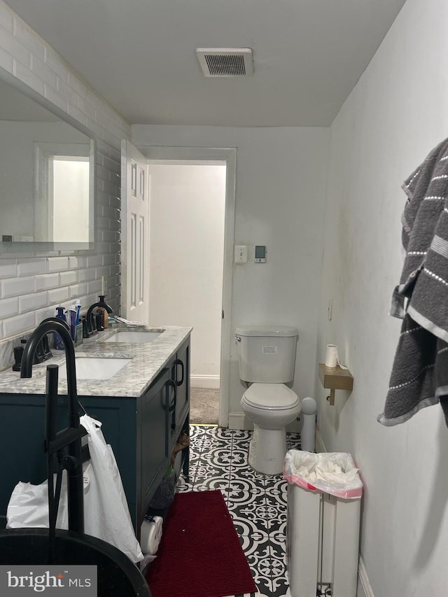 2612 E Somerset St, Philadelphia, PA 19134 - bathroom with vanity and backsplash