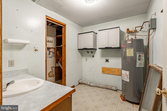 1721 Pioneer Rd, Lancaster, PA 17602 - bathroom featuring electric water heater, tile patterned floors, and vanity