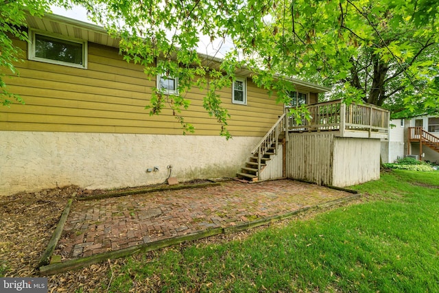 1721 Pioneer Rd, Lancaster, PA 17602 - view of grassy yard featuring stairway, a deck, and a patio area