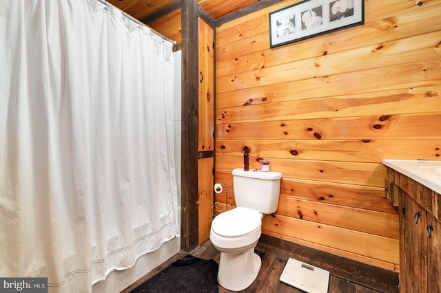 1015 N Duke St, York, PA 17404 - bathroom with vanity, wood finished floors, and wood walls