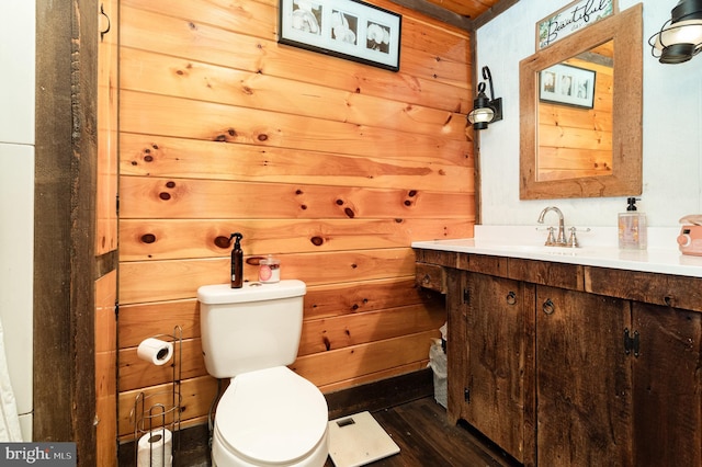 1015 N Duke St, York, PA 17404 - half bathroom with vanity, wood finished floors, and wood walls