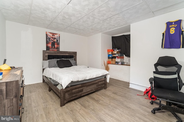 1015 N Duke St, York, PA 17404 - bedroom with light wood-style flooring and a paneled ceiling