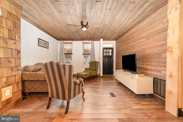 1015 N Duke St, York, PA 17404 - living room featuring wooden walls, hardwood / wood-style flooring, ceiling fan, and wood ceiling