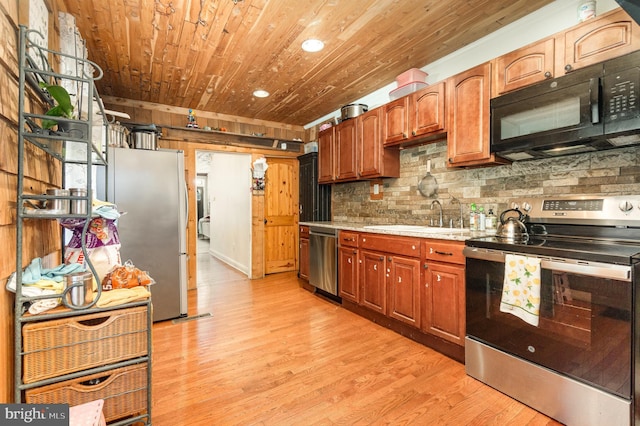 1015 N Duke St, York, PA 17404 - kitchen with stainless steel appliances, wooden ceiling, light countertops, light wood-type flooring, and decorative backsplash