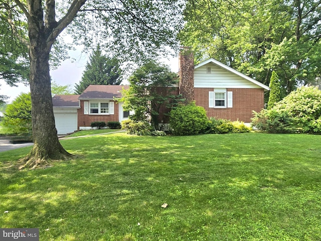 2200 Inwood Rd, Wilmington, DE 19810 - ranch-style house featuring brick siding, a front lawn, a chimney, and a garage