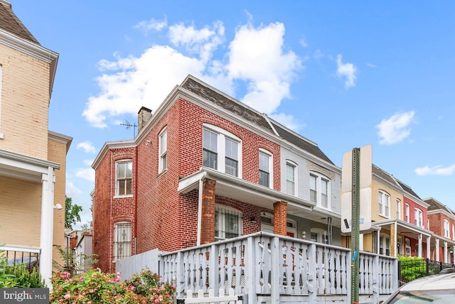 745 Gresham Pl NW, Washington, DC 20001 - view of property exterior featuring brick siding and a chimney