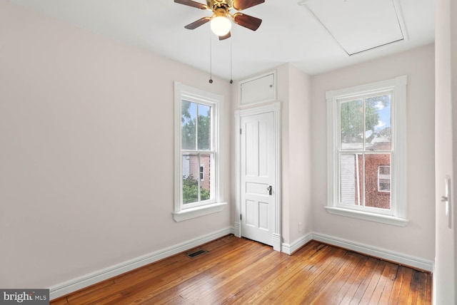 745 Gresham Pl NW, Washington, DC 20001 - unfurnished bedroom featuring light wood-style floors and multiple windows