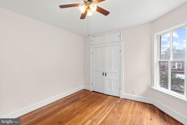745 Gresham Pl NW, Washington, DC 20001 - unfurnished bedroom with light wood-style floors, a closet, and a ceiling fan
