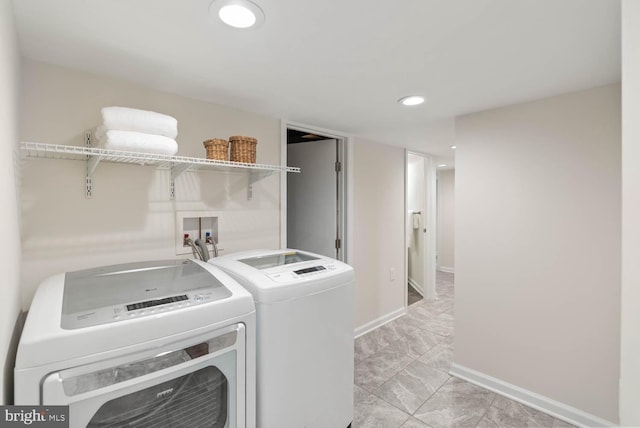 745 Gresham Pl NW, Washington, DC 20001 - laundry room with washer and dryer, light marble finish flooring, and recessed lighting