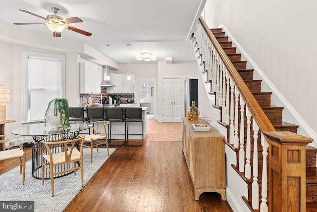 745 Gresham Pl NW, Washington, DC 20001 - dining space featuring ceiling fan, stairway, and wood finished floors