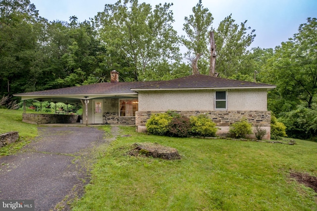 35 Strimples Mill Rd, Stockton, NJ 08559 - view of front of home with stone siding, a front lawn, driveway, and a porch