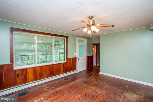 35 Strimples Mill Rd, Stockton, NJ 08559 - unfurnished room featuring a baseboard radiator, a ceiling fan, hardwood / wood-style floors, wainscoting, and wooden walls