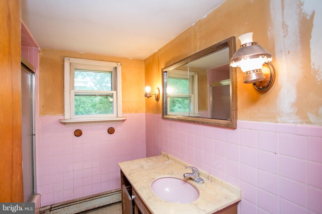 35 Strimples Mill Rd, Stockton, NJ 08559 - full bathroom with tile walls, baseboard heating, vanity, a wainscoted wall, and a shower with door