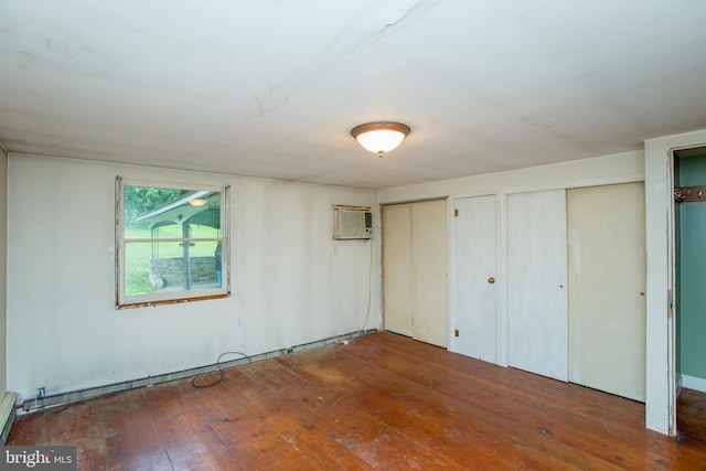 35 Strimples Mill Rd, Stockton, NJ 08559 - unfurnished bedroom with hardwood / wood-style floors, two closets, and an AC wall unit