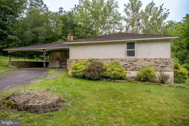 35 Strimples Mill Rd, Stockton, NJ 08559 - view of property exterior with asphalt driveway, a chimney, a lawn, stone siding, and an attached carport