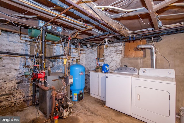 35 Strimples Mill Rd, Stockton, NJ 08559 - unfinished below grade area featuring washer and clothes dryer, a water pressure tank, and a heating unit