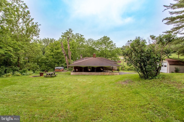 35 Strimples Mill Rd, Stockton, NJ 08559 - view of green lawn featuring an outdoor structure and a garage