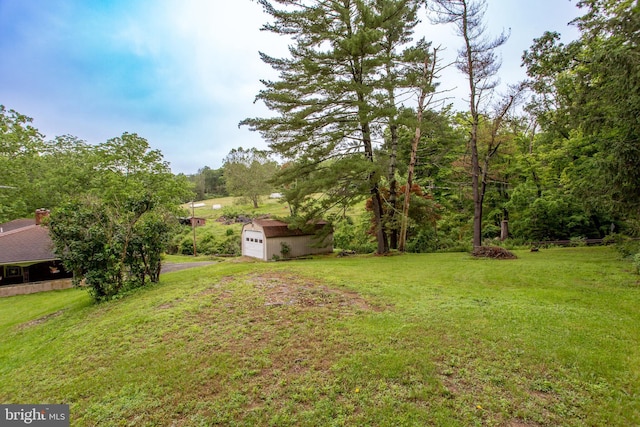 35 Strimples Mill Rd, Stockton, NJ 08559 - view of grassy yard with driveway, an outdoor structure, and an attached garage