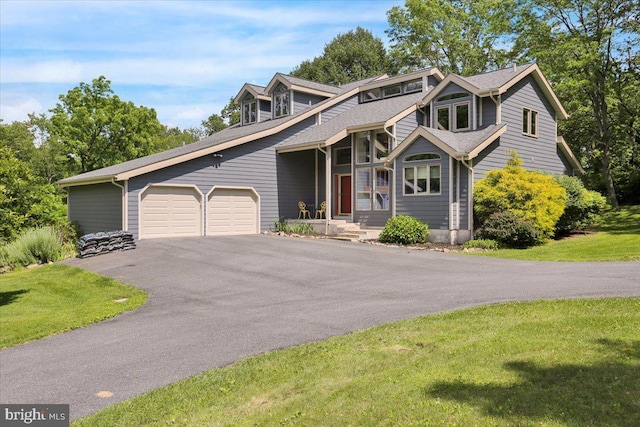 6 Sadowski Dr, Reading, PA 19606 - mid-century inspired home with asphalt driveway, an attached garage, and a front lawn