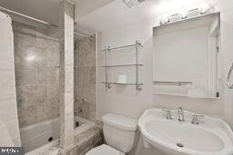 3241 N St NW Unit 1, Washington, DC 20007 - bathroom with a sink and tiled shower / bath
