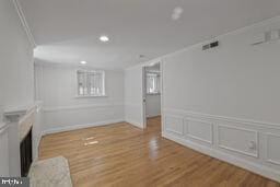 3241 N St NW Unit 1, Washington, DC 20007 - unfurnished living room featuring recessed lighting, wood finished floors, and a decorative wall