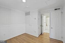 3241 N St NW Unit 1, Washington, DC 20007 - empty room featuring wood finished floors and attic access